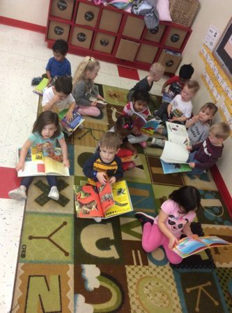 preschool_children_reading_books_at_phoenix_childrens_academy_private_preschool_chandler_dobson-333x450