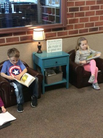 preschool_children_reading_in_the_lobby_canterbury_academy_at_shawnee_crossings_shawnee_ks-336x450