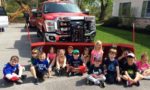 preschool_children_sitting_in_front_of_truck_at_cadence_academy_collegeville_pa-1024x614-750x450