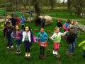 preschool_children_standing_on_stumps_cadence_academy_preschool_tacoma_wa-600x450