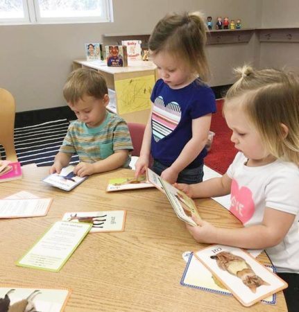 preschool_children_with_reading_cards_gateway_academy_mckee_charlotte_nc-431x450