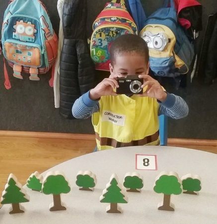 preschool_construction_worker_taking_photo_of_eight_trees_sunbrook_academy_at_barnes_mill_austell_ga-437x450