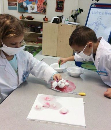 preschool_doctors_playing_with_cotton_balls_cadence_academy_chesterfield_mo-386x450