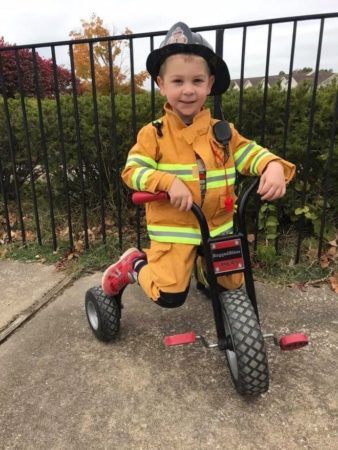 preschool_fireman_on_tricycle_cadence_academy_chesterfield_mo-338x450