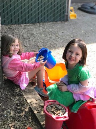 preschool_friends_hanging_out_on_the_playground_at_cadence_academy_preschool_sellwood_portland_or-338x450
