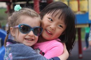 preschool_friends_on_the_playground_learning_edge_childcare_and_preschool_new_berlin_wi-676x450