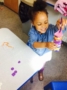 preschool_girL-stacking_buttons_on_pipe_cleaner_rogys_learning_place_lake_street_peoria_heights_il-336x450