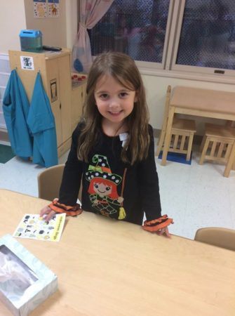 preschool_girl_about_to_play_halloween_bingo_cadence_academy_chesterfield_mo-335x450