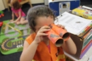 preschool_girl_binocular_art_project_at_cadence_academy_preschool_dallas_tx-675x450