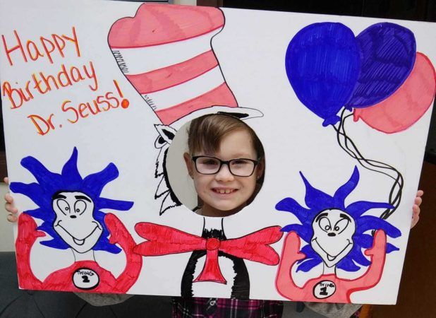preschool_girl_celebrating_dr_seusss_birthday_creative_expressions_learning_center_imperial_mo-618x450