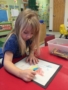 preschool_girl_coloring_and_writing_at_cadence_academy_preschool_broomfield_co-338x450
