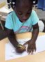 preschool_girl_coloring_apples_at_cadence_academy_preschool_branch_hollow_carrollton_tx-329x450