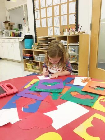 preschool_girl_coloring_with_cutouts_gateway_academy_mckee_charlotte_nc-338x450