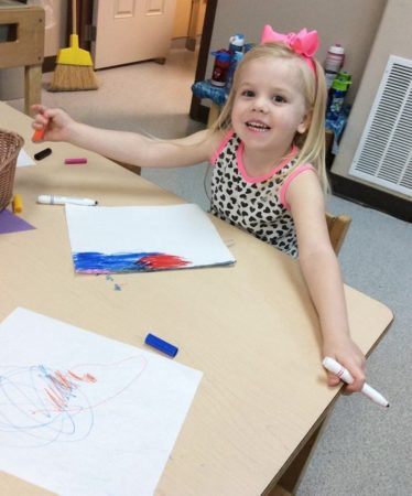 preschool_girl_coloring_with_marker_cadence_academy_preschool_dupont_wa-374x450