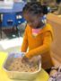 preschool_girl_cooking_activity_cadence_academy_preschool_summerville_sc-342x450