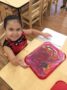 preschool_girl_doing_finger_painting_cadence_academy_preschool_austin_cedar_park_tx-336x450