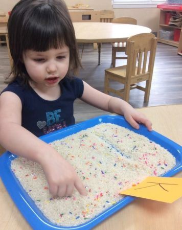 preschool_girl_doing_letter_k_activity_cadence_academy_preschool_yelm_highway_olympia_wa-356x450