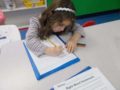 preschool_girl_doing_sight_word_worksheet_creative_kids_childcare_centers_yorktown-600x450