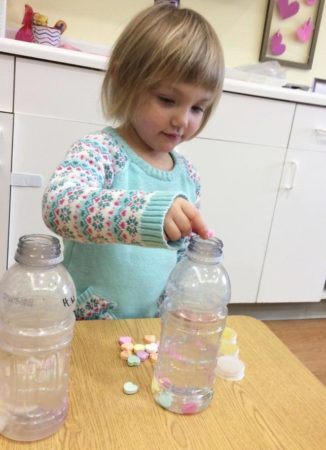 preschool_girl_doing_valentines_day_science_activity_at_next_generation_childrens_centers_marlborough_ma-326x450