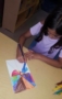 preschool_girl_drawing_geometric_shapes_winwood_childrens_center_brambleton_ii_va-287x450