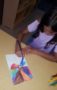 preschool_girl_drawing_geometric_shapes_winwood_childrens_center_brambleton_ii_va-287x450