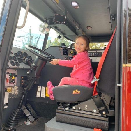 preschool_girl_driving_the_fire_engine_prime_time_early_learning_centers_edgewater_nj-450x450