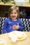 preschool_girl_eating_lunch_cadence_academy_preschool_steele_creek_charlotte_nc-300x450