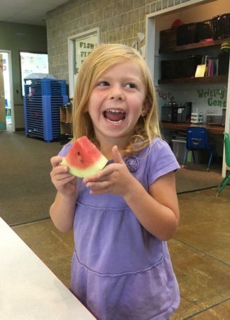 preschool_girl_eating_watermellon_canterbury_academy_at_shawnee_crossings_shawnee_ks-324x450