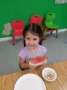 preschool_girl_eating_watermellon_creative_kids_childcare_centers_mahopac-336x450