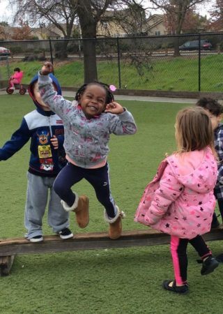 preschool_girl_enjoying_balance_beam_at_the_phoenix_schools_private_preschool_antelope_ca-320x450