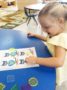 preschool_girl_enjoying_button_cat_activity_cadence_academy_preschool_myrtle_beach_sc-333x450