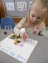 preschool_girl_enjoying_letter_matching_activity_cadence_academy_preschool_ankeny_ia-338x450