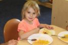 preschool_girl_enjoying_lunch_cadence_academy_cordova_tn-1024x683-675x450