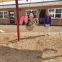 preschool_girl_enjoying_swing_with_teacher_sunbrook_academy_at_luella_mcdonough_ga-450x450