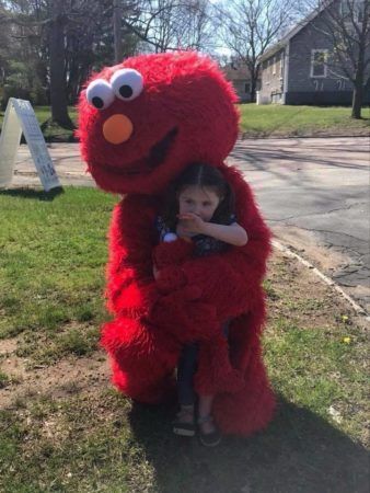 preschool_girl_getting_hug_from_elmo_cadence_academy_preschool_west_bridgewater_ma-338x450