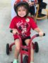 preschool_girl_in_helmet_on-tricycle_at_sunbrook_academy_at_luella_mcdonough_ga-338x450