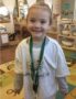 preschool_girl_in_kindergarten_club_t-shirt_at_cadence_academy_preschool_columbine_littleton_co-344x450