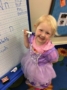 preschool_girl_in_princess_dress_writing_the_alphabet_cadence_academy_chesterfield_mo-336x450
