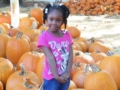 preschool_girl_in_pumpkin_patch_cadence_academy_preschool_harbison_columbia_sc-600x450