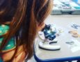 preschool_girl_looking_through_microscope_winwood_childrens_center_lansdowne_va-574x450