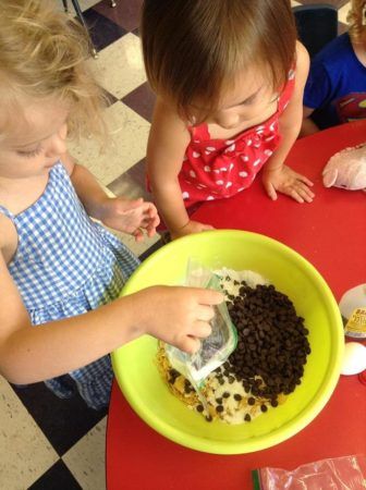 preschool_girl_making_cookies_at_cadence_academy_preschool_roseville_galleria_ca-336x450