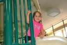 preschool_girl_on_indoor_slide_at_the_peanut_gallery_temple_tx-675x450