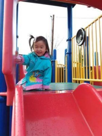 preschool_girl_on_playground_at_cadence_academy_preschool_clackamas_or-338x450