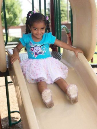 preschool_girl_on_slide_at_sunbrook_academy_at_luella_mcdonough_ga-338x450