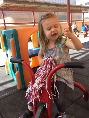 preschool_girl_on_tricycle_at_cadence_academy_preschool_i_street_sacramento_ca-338x450