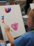 preschool_girl_painting_a_horse_canterbury_preparatory_school_overland_park_ks-338x450