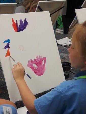 preschool_girl_painting_a_horse_canterbury_preparatory_school_overland_park_ks-338x450
