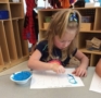 preschool_girl_painting_letter_b_winwood_childrens_center_gainesville_ii_va-463x450