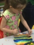 preschool_girl_painting_on_a_plate_fredericksburg_childrens_academy_fredericksburg_va-338x450