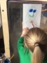 preschool_girl_painting_on_easel_cadence_academy_preschool_tumwater_wa-336x450